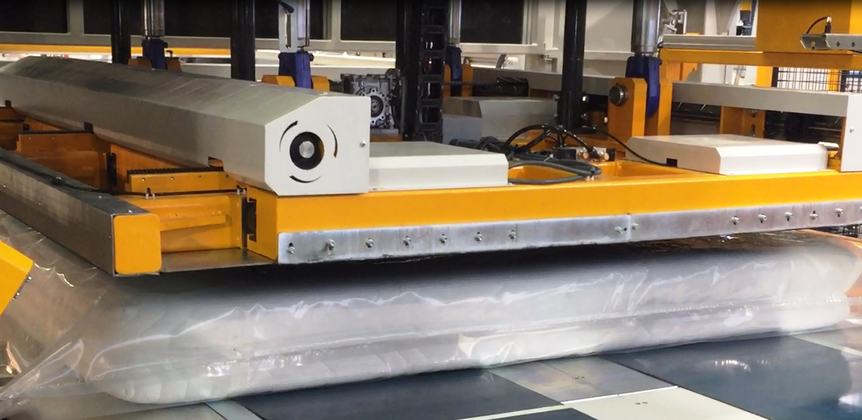 A machine that compresses the mattress from 10" to 1" thick